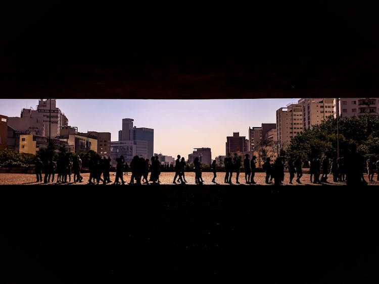 Silhouette Of People In Queue