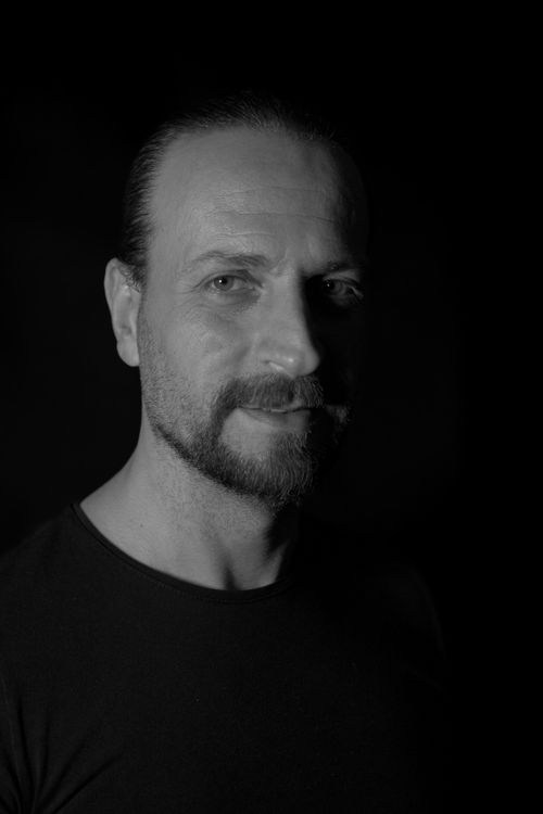 Free Dramatic black and white portrait of a man with a contemplative expression. Stock Photo