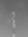 Monochrome Telecommunication Tower Against Sky