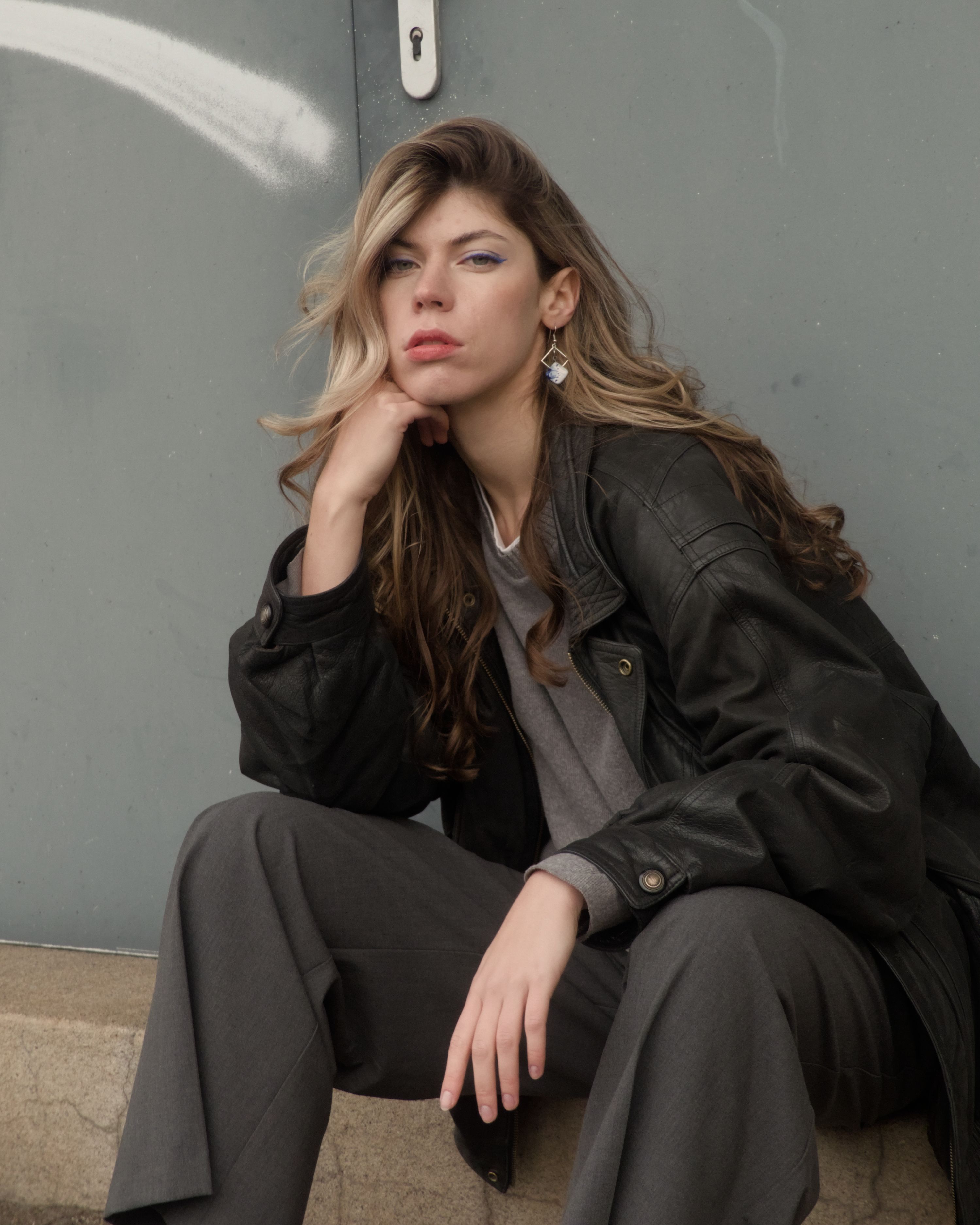 Stylish Woman in Gray Urban Setting · Free Stock Photo
