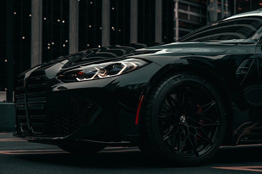 A dramatic shot of a modern black BMW car in downtown Chicago, showcasing urban sophistication.