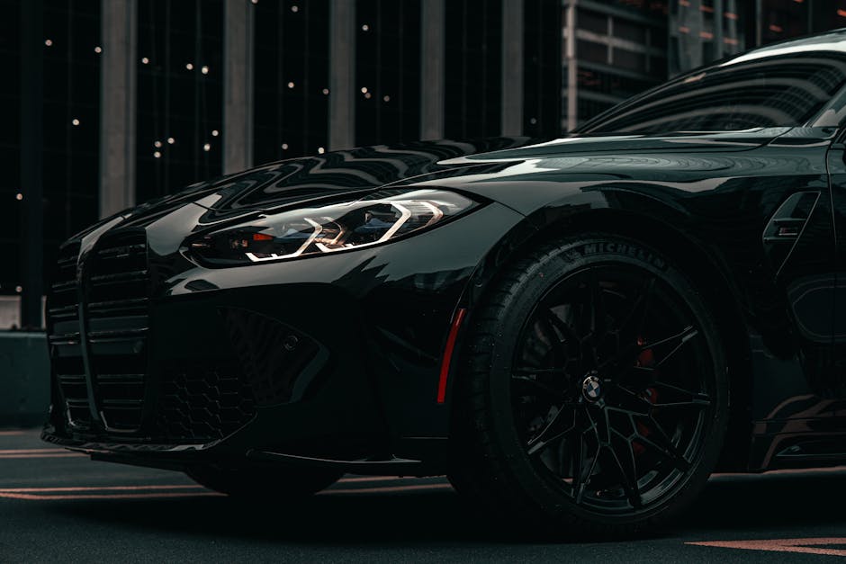 A dramatic shot of a modern black BMW car in downtown Chicago, showcasing urban sophistication.