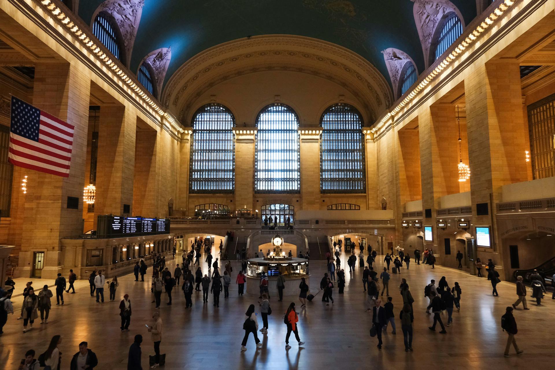 Grand Central Terminal interior bustling with visitors under iconic architecture in New York City.