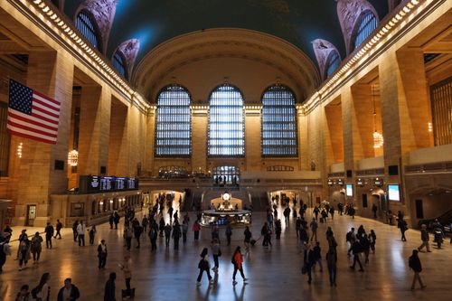 Free Grand Central Terminal interior bustling with visitors under iconic architecture in New York City. Stock Photo