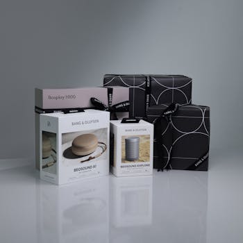 Stylish display of Bang & Olufsen Beosound and Beoplay speakers with elegant gift packaging.