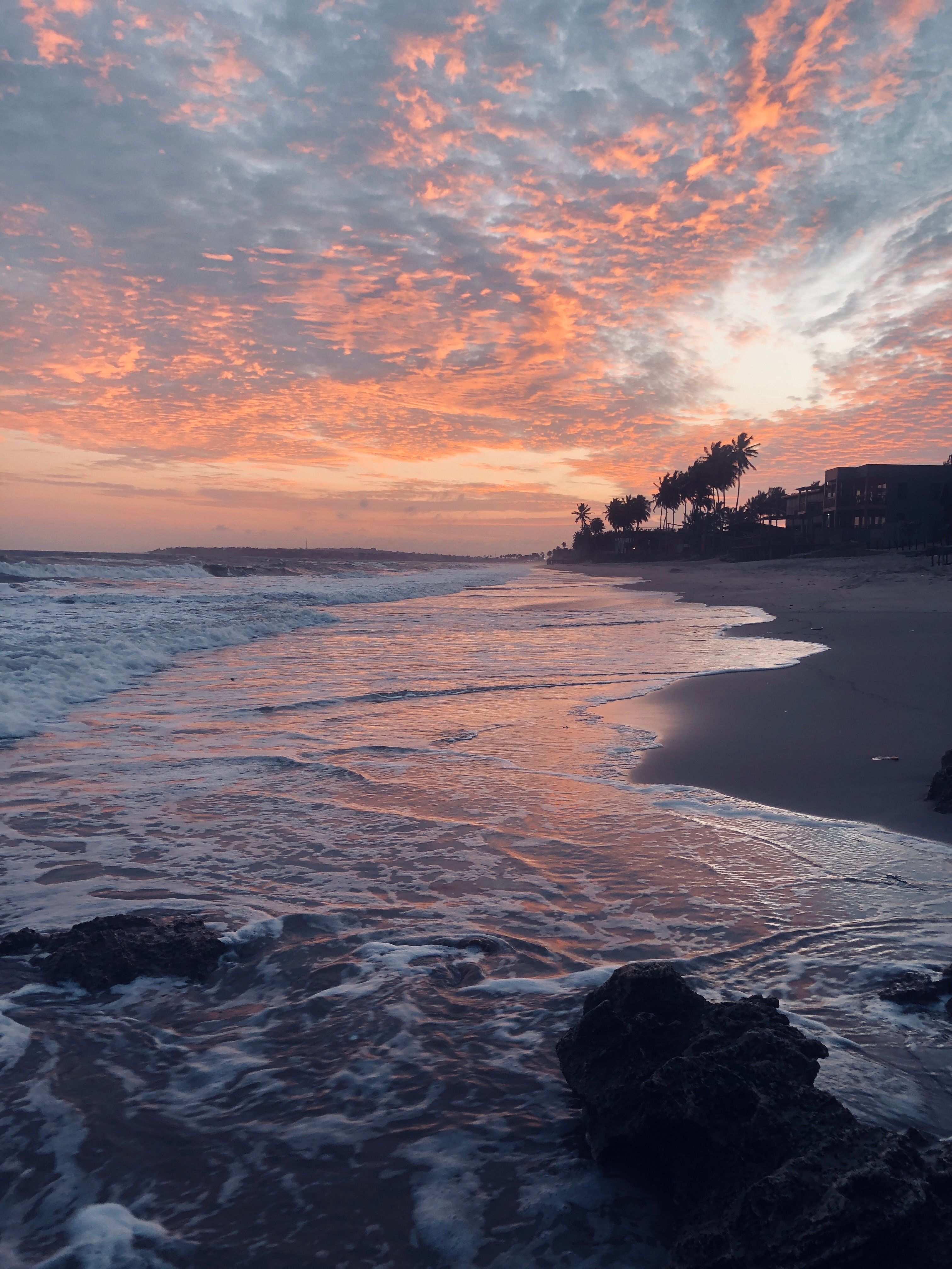 Stunning Beach Sunset with Vibrant Sky and Waves · Free Stock Photo