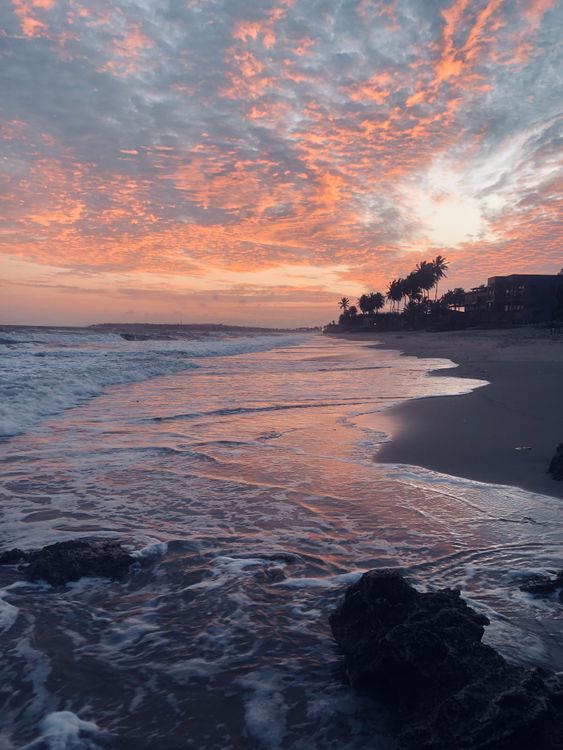 Stunning Beach Sunset with Vibrant Sky and Waves · Free Stock Photo