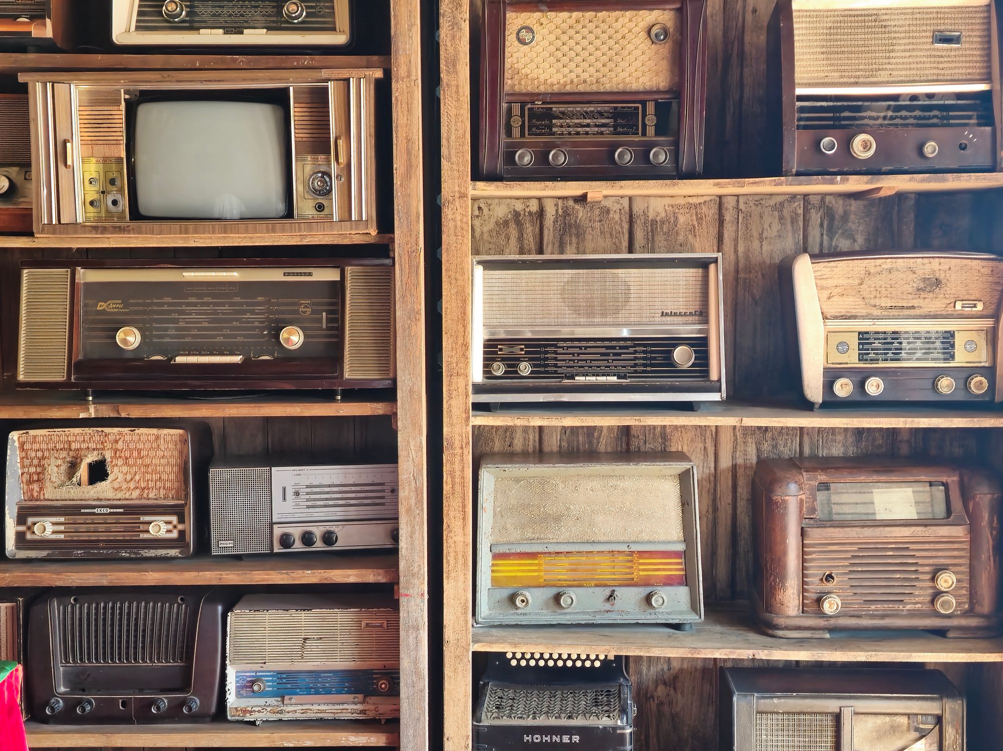 Vintage Radios Collection On Wooden Shelves In Dubai Free Stock Photo vintage-radios-collection-on-wooden-shelves-in-dubai-free-stock-photo