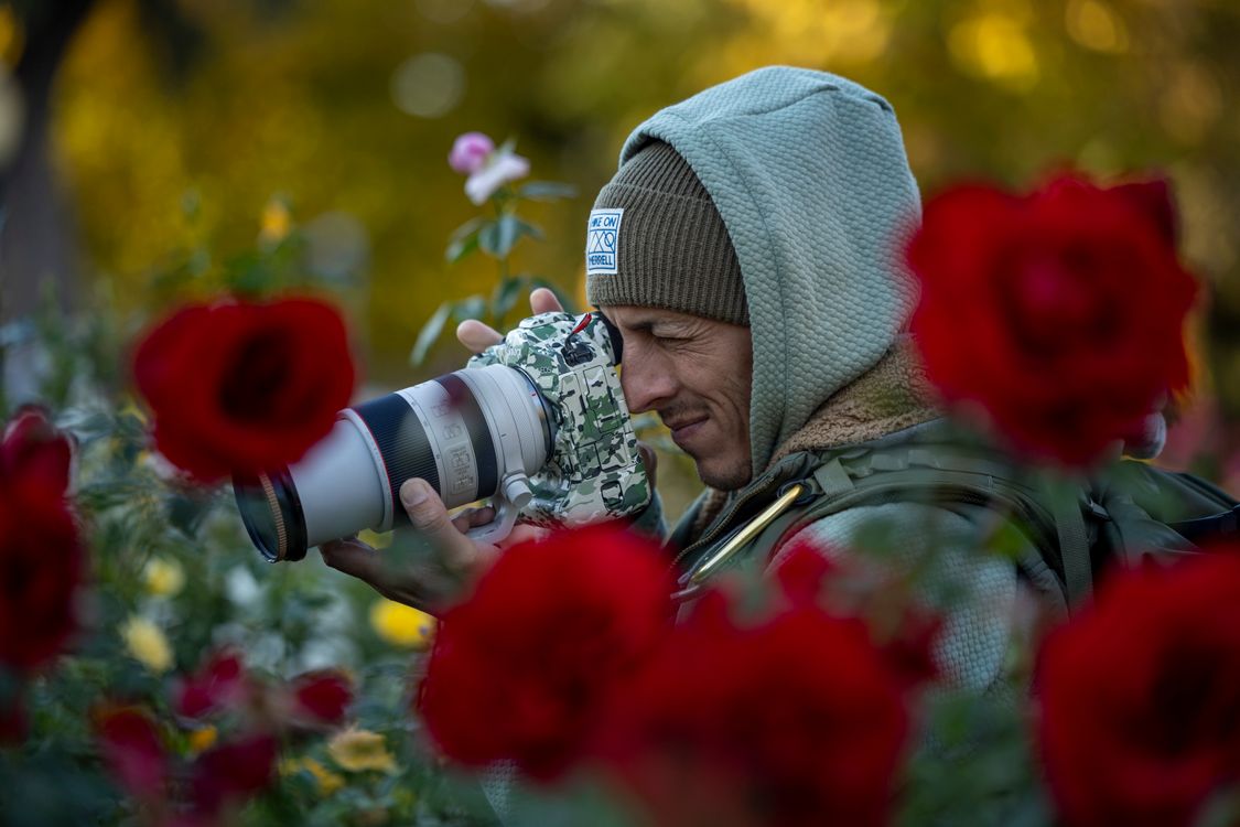 Photographer Capturing Nature with SLR Camera · Free Stock Photo