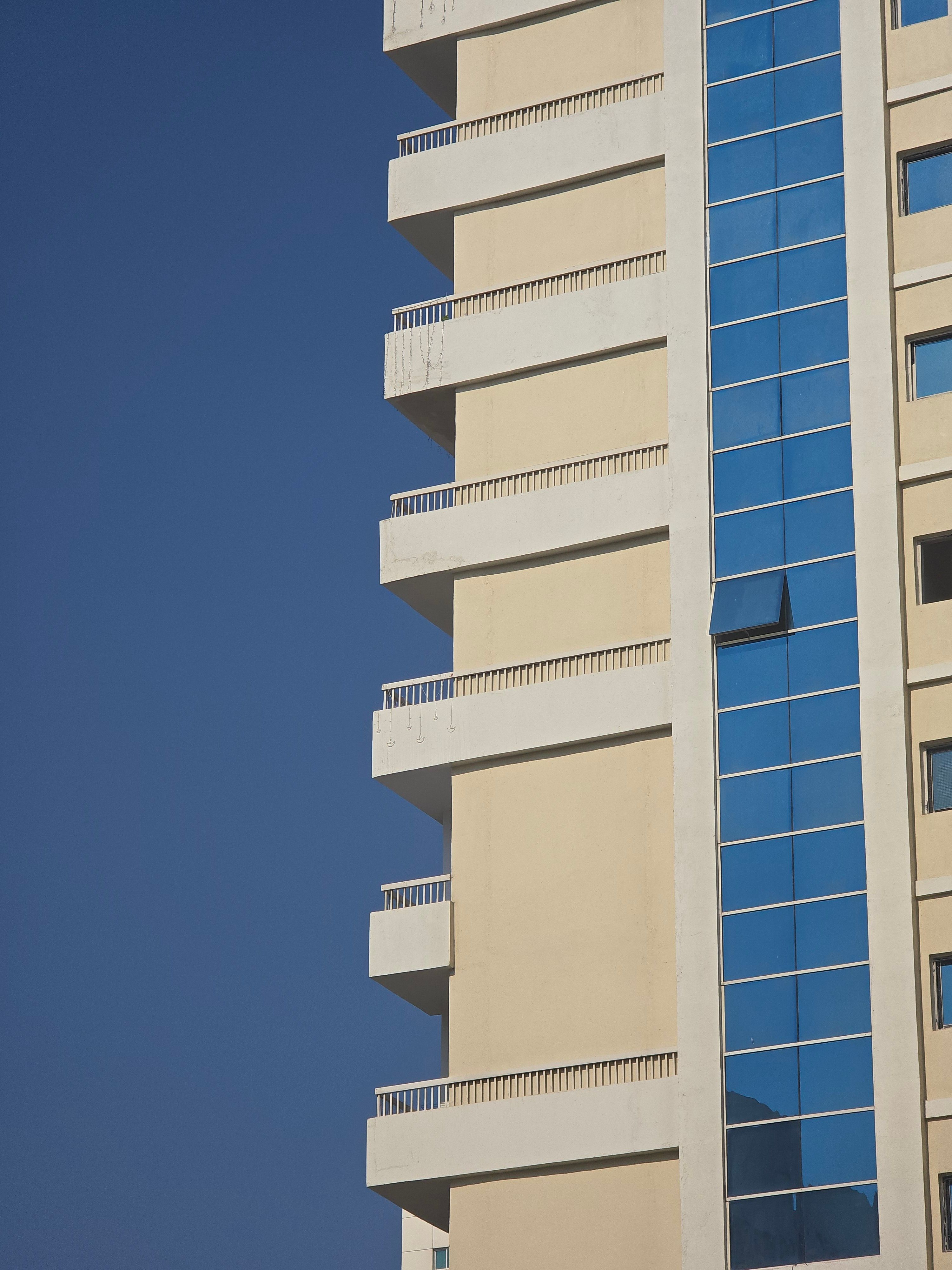 Modern Skyscraper with Blue Glass Windows in Urban Setting · Free Stock ...