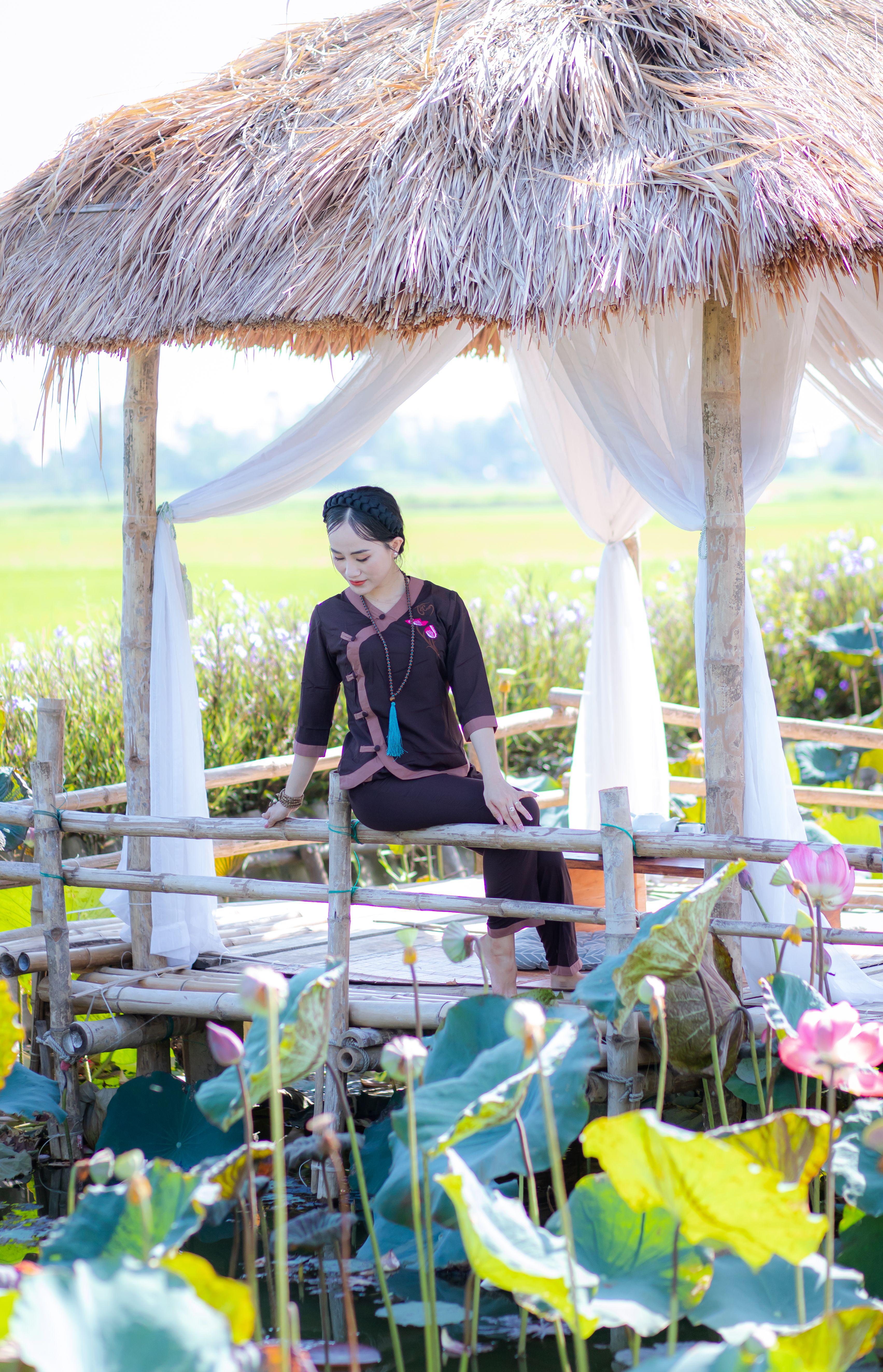 Traditional Vietnamese Woman in Lotus Garden Pavilion