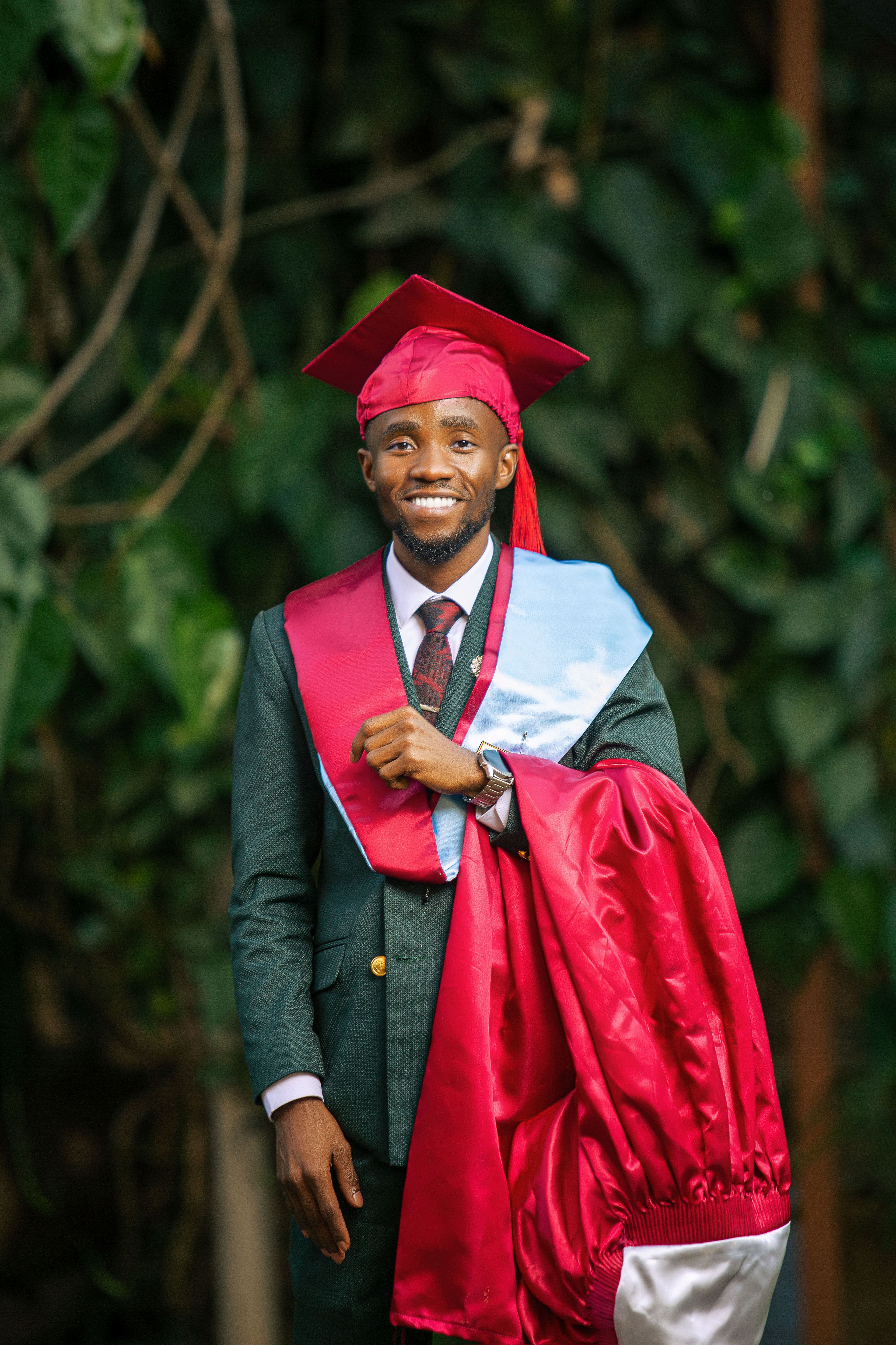Young Graduate Celebrating in Cap and Gown · Free Stock Photo