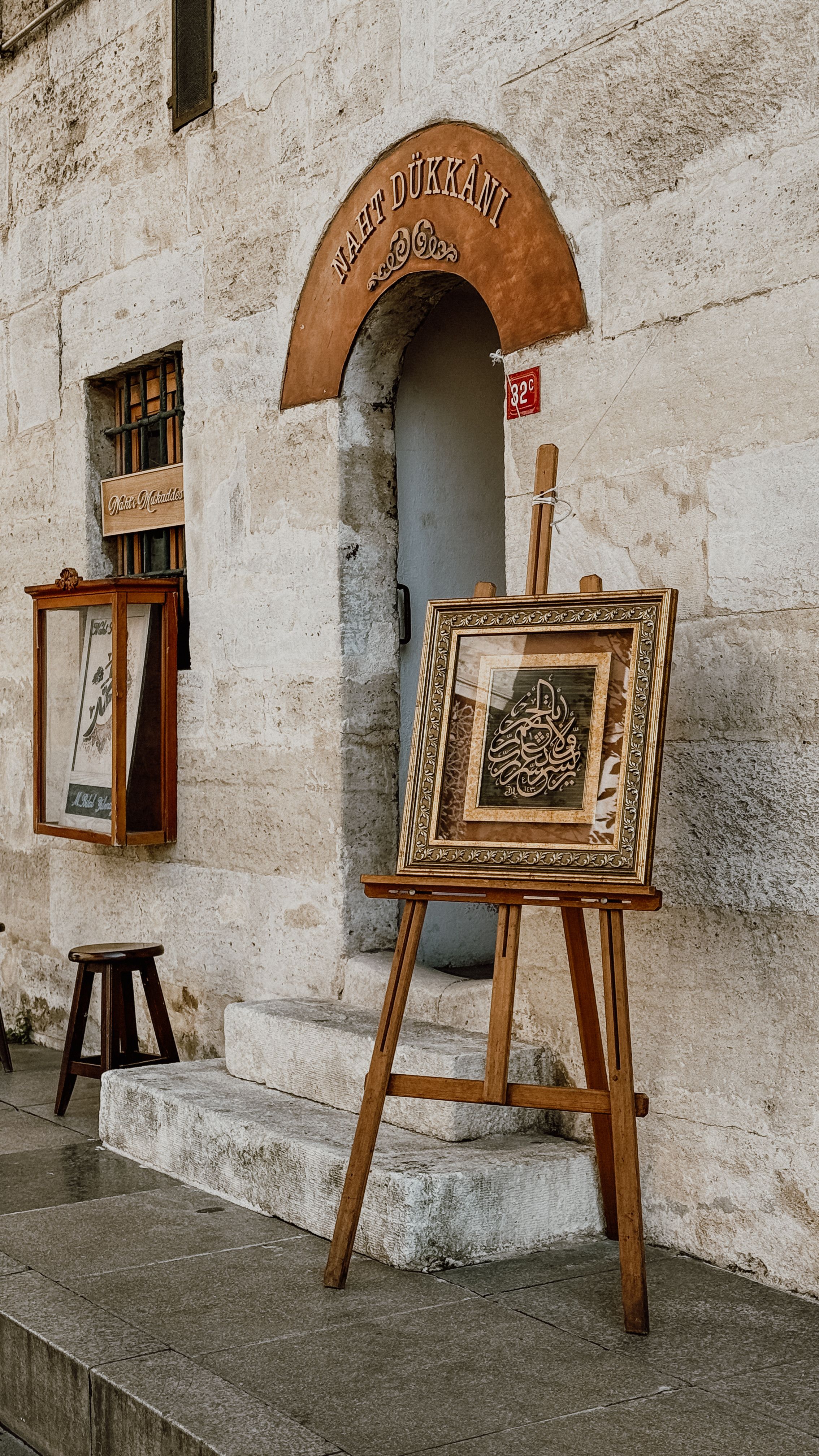 Vintage Art Shop with Framed Calligraphy Display · Free Stock Photo