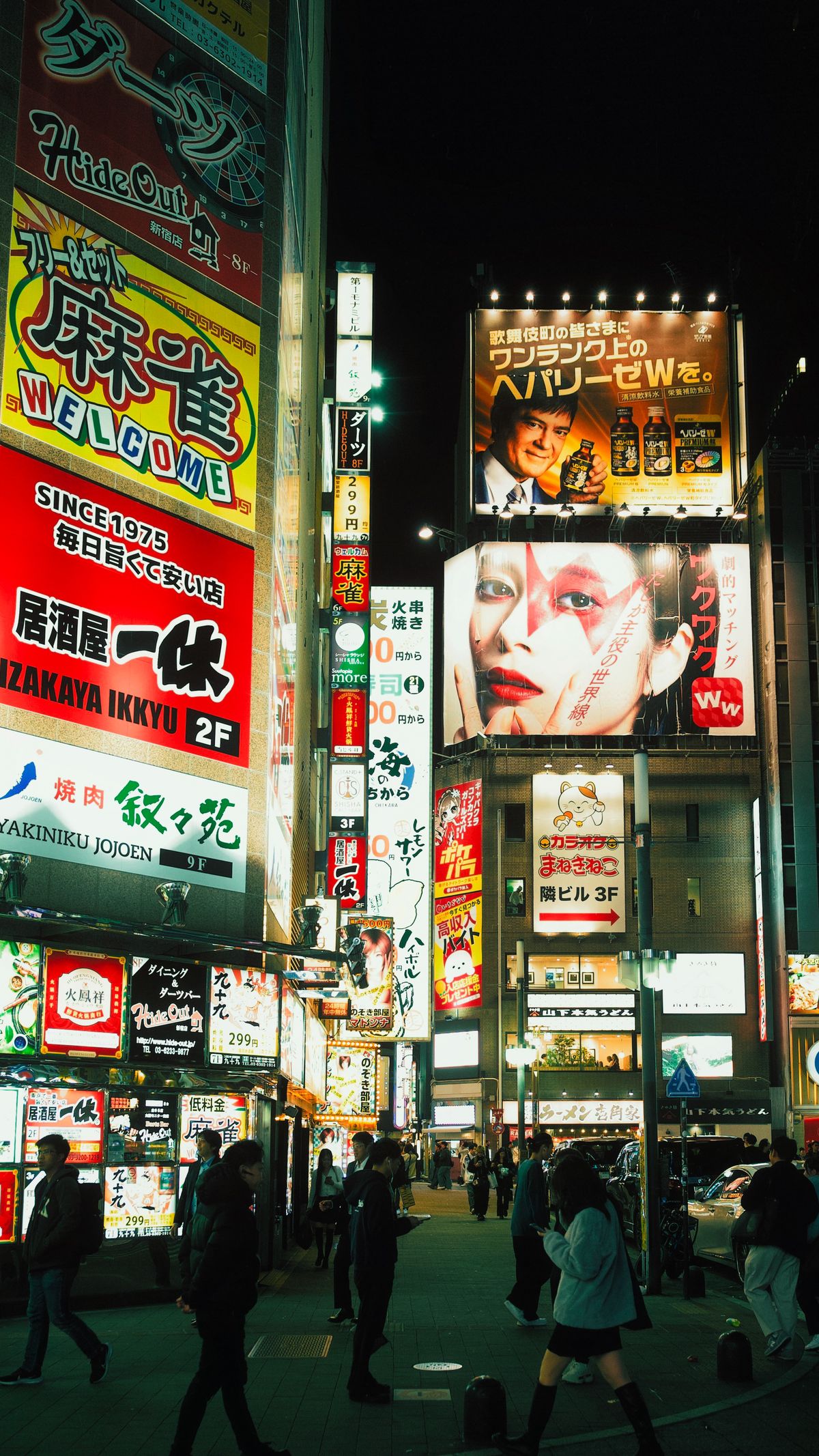 Vibrant Tokyo Nightlife on a Busy Street · Free Stock Photo