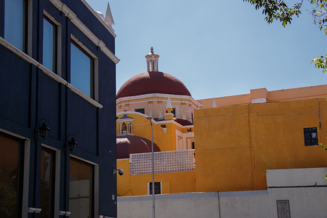 Colonial Building Backround Colorful Colonial Architecture in Bright Sunlight · Free Stock Photo