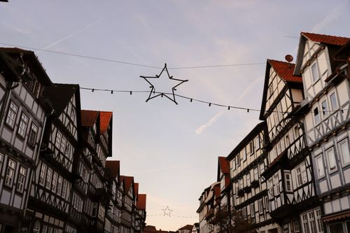Free Traditional Fachwerk houses in Bad Sooden-Allendorf at dusk, adorned with star lights. Stock Photo