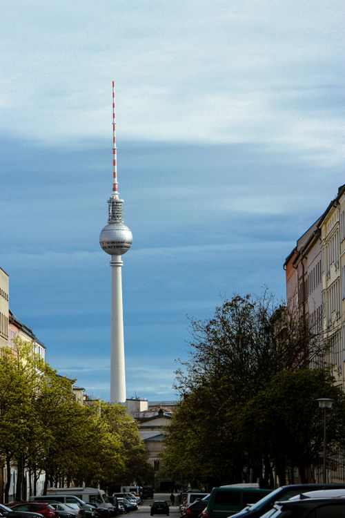 Free Stunning view of the Berlin Television Tower with a blue sky and cityscape foreground. Stock Photo