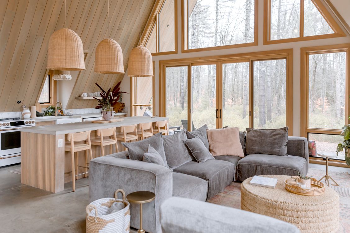 Cozy Modern Cabin Interior with Large Windows · Free Stock Photo