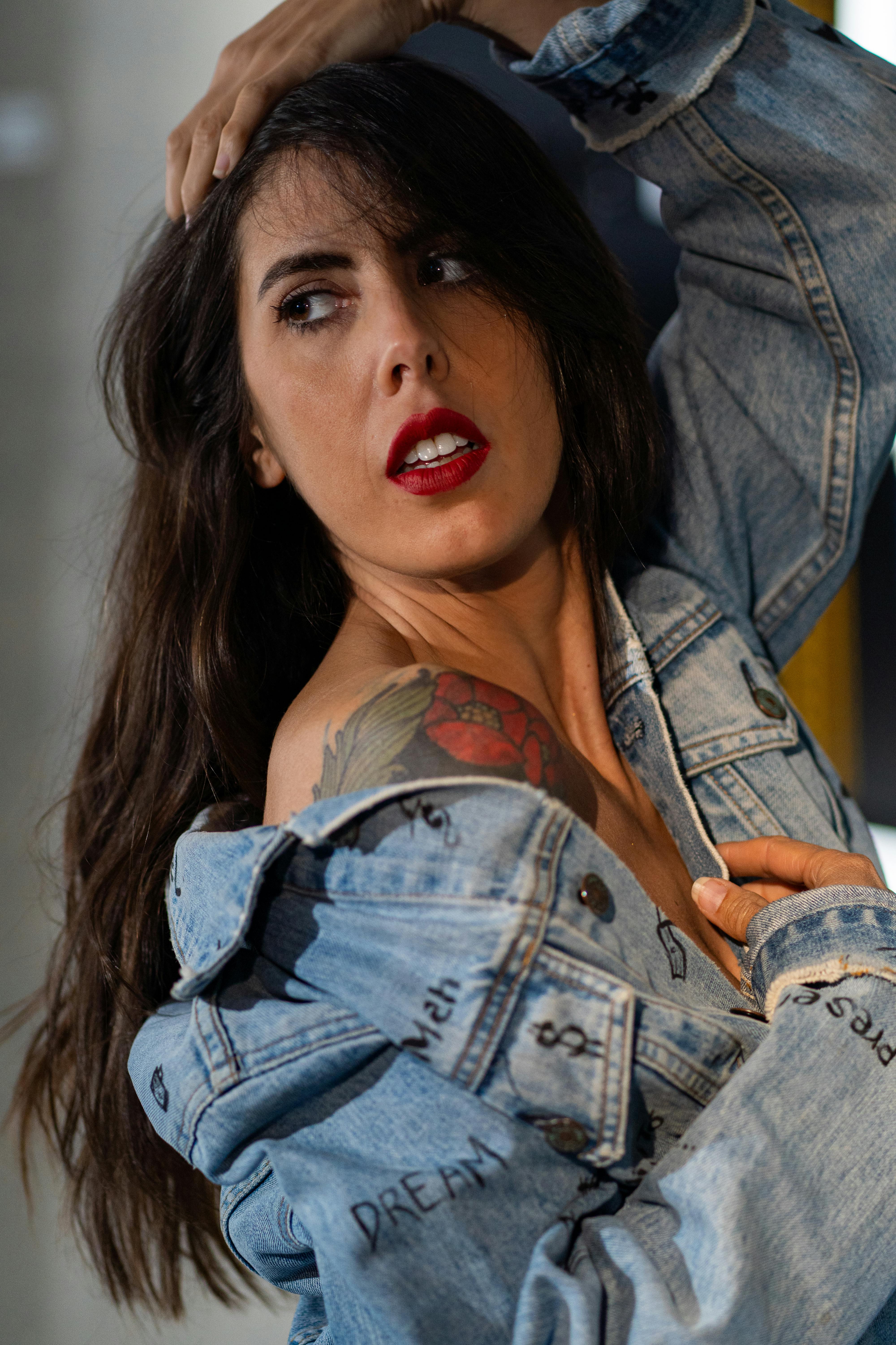stylish woman posing with denim jacket in portrait