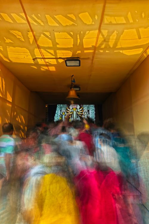 Free Blurred crowd capturing the energy of Kolkata's Durga Puja festival. Stock Photo