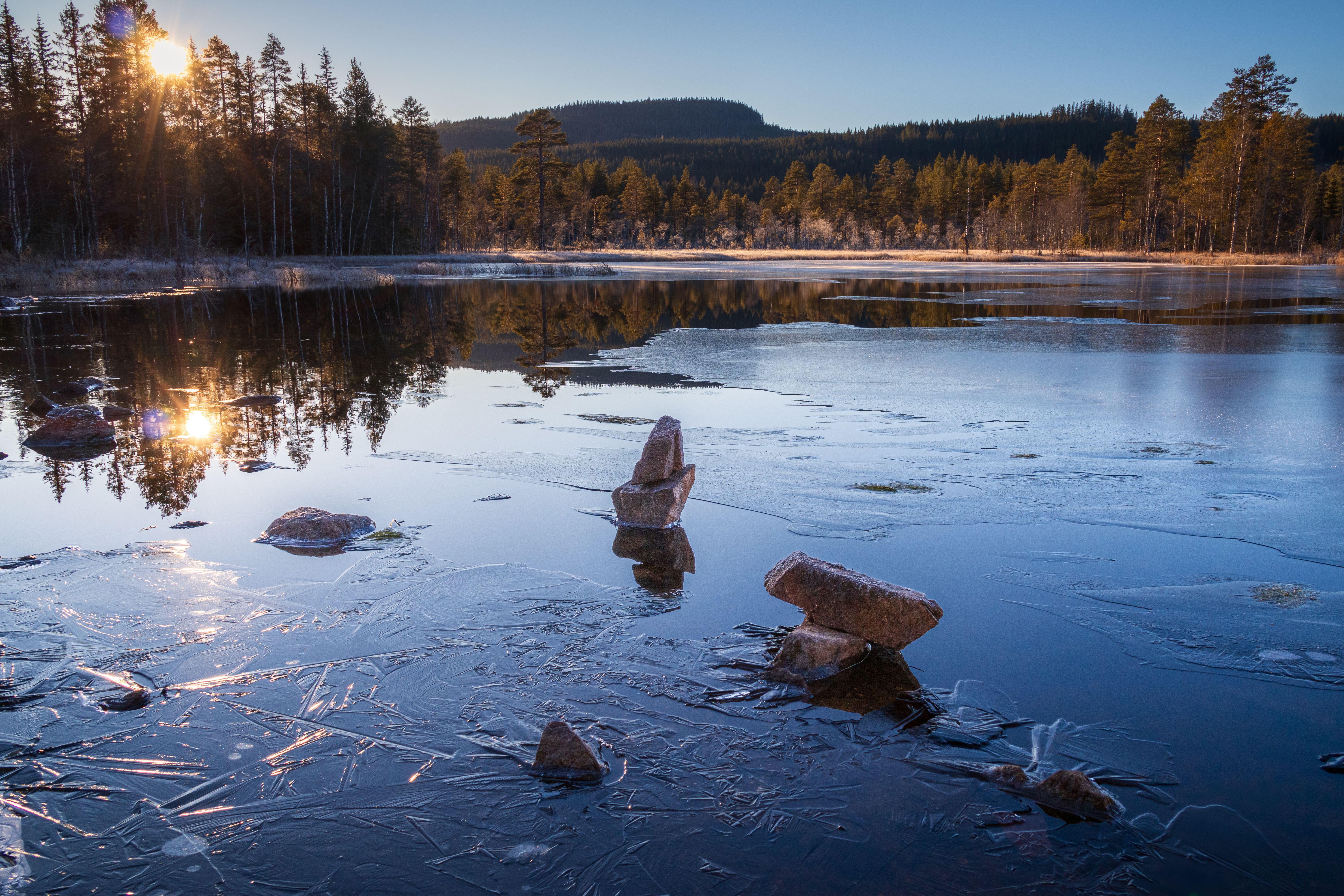 Serene Winter Sunrise Over a Frozen Lake · Free Stock Photo