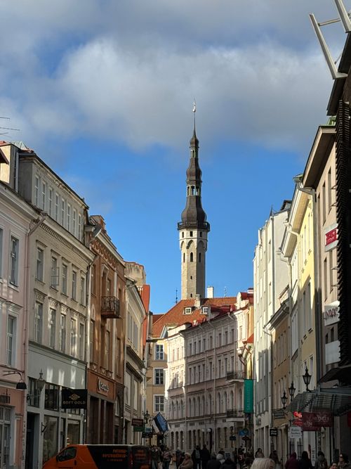 Free Charming street view of Tallinn's Old Town with the iconic St. Olaf's Church tower in Estonia. Stock Photo