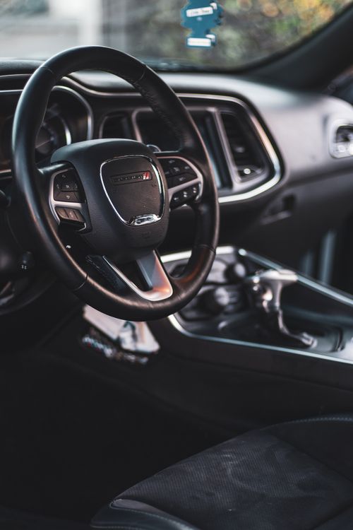 Free Close-up view of a modern car interior featuring a sleek dashboard and leather seats. Stock Photo