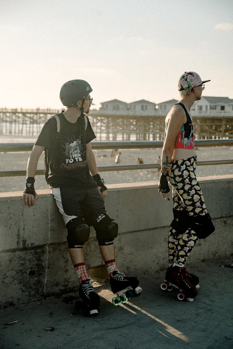 Man And Woman Wearing Roller Skates