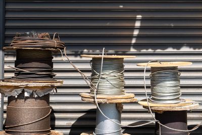 Large spools of industrial cable stacked in a storage yard. Photo by Andrew Durkin on Pexels