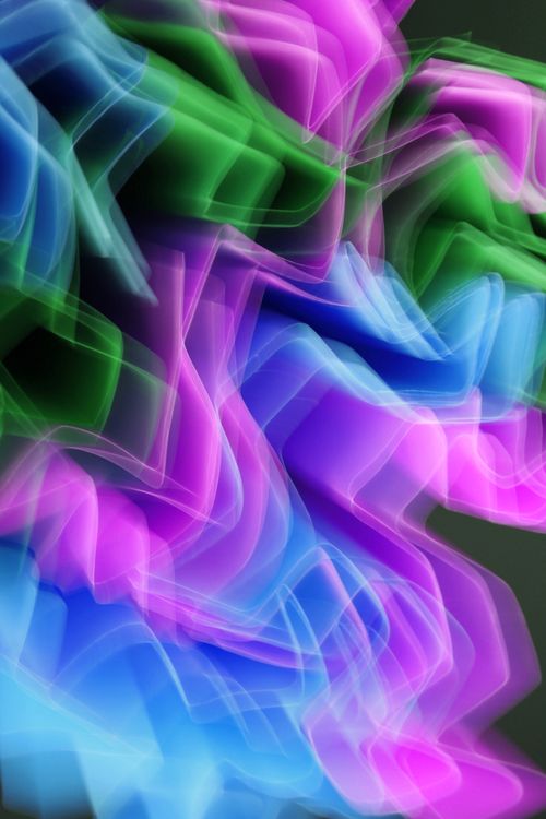 Free Vibrant abstract light painting featuring swirling colors of pink, blue, and green. Stock Photo