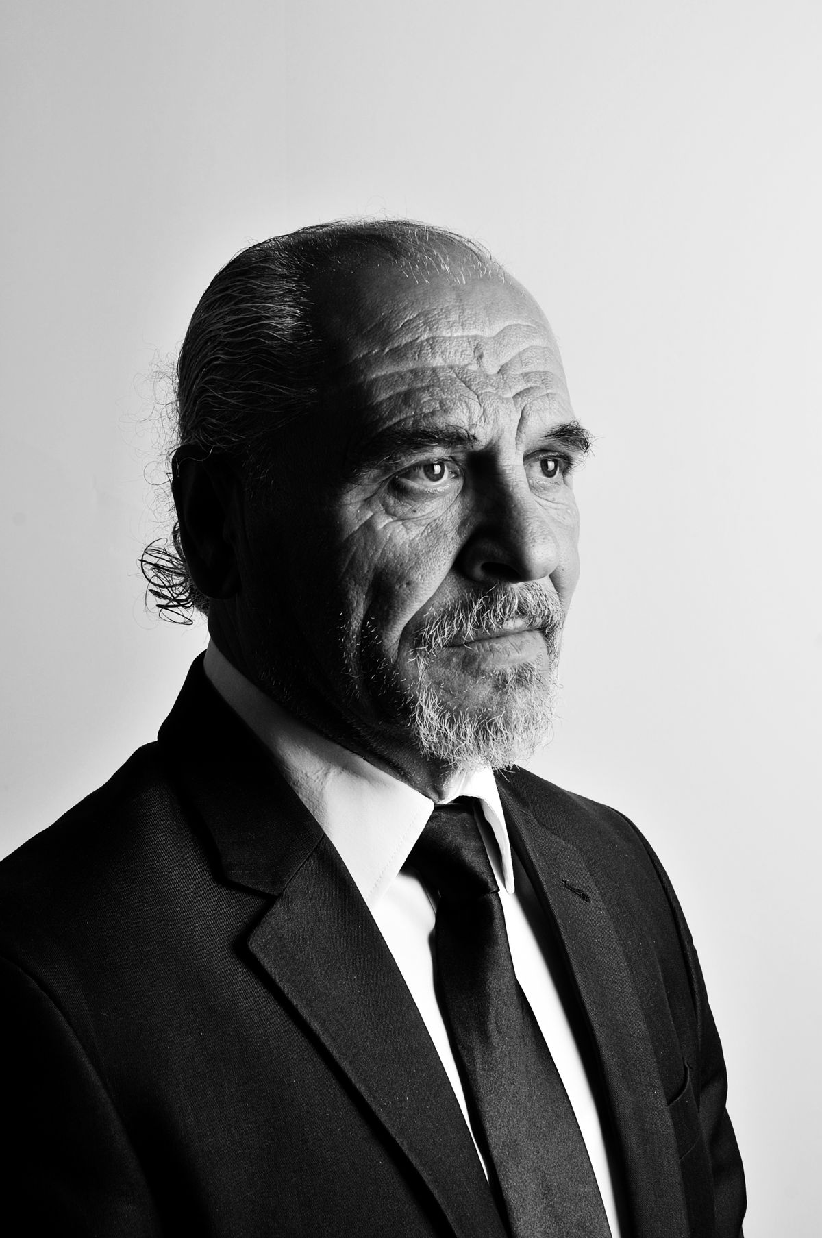 Mature business executive representing the company's founding legacy