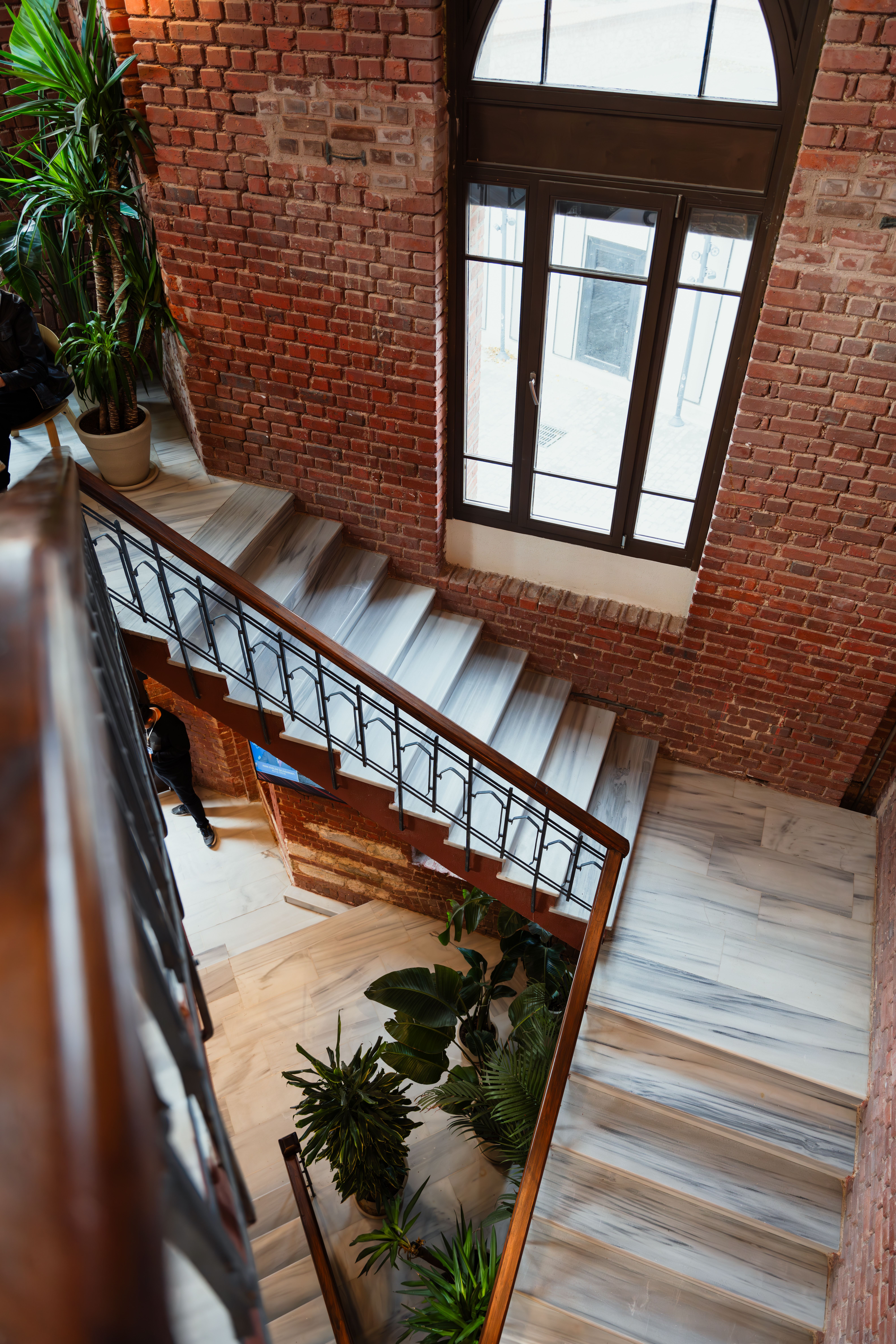 Stylish brick interior with elegant stairs · Free Stock Photo