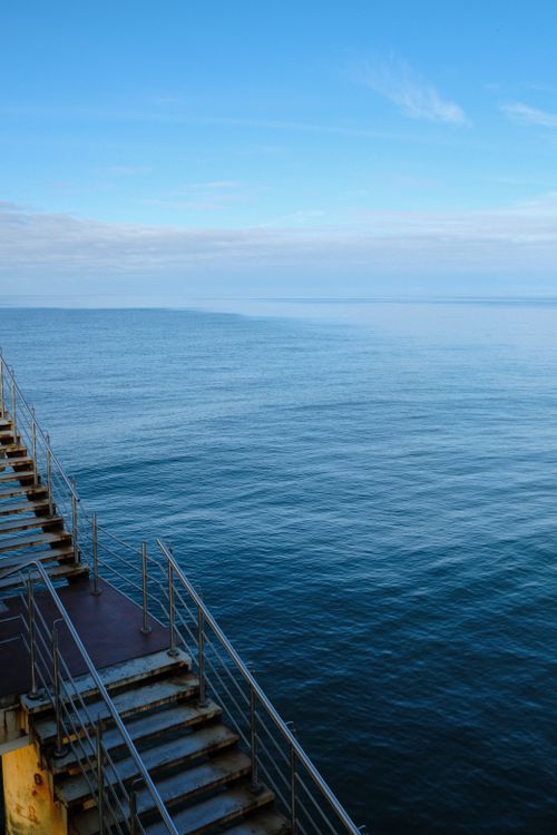 Free Calm ocean view from a metal pier with clear blue sky in Kaliningrad, Russia. Stock Photo