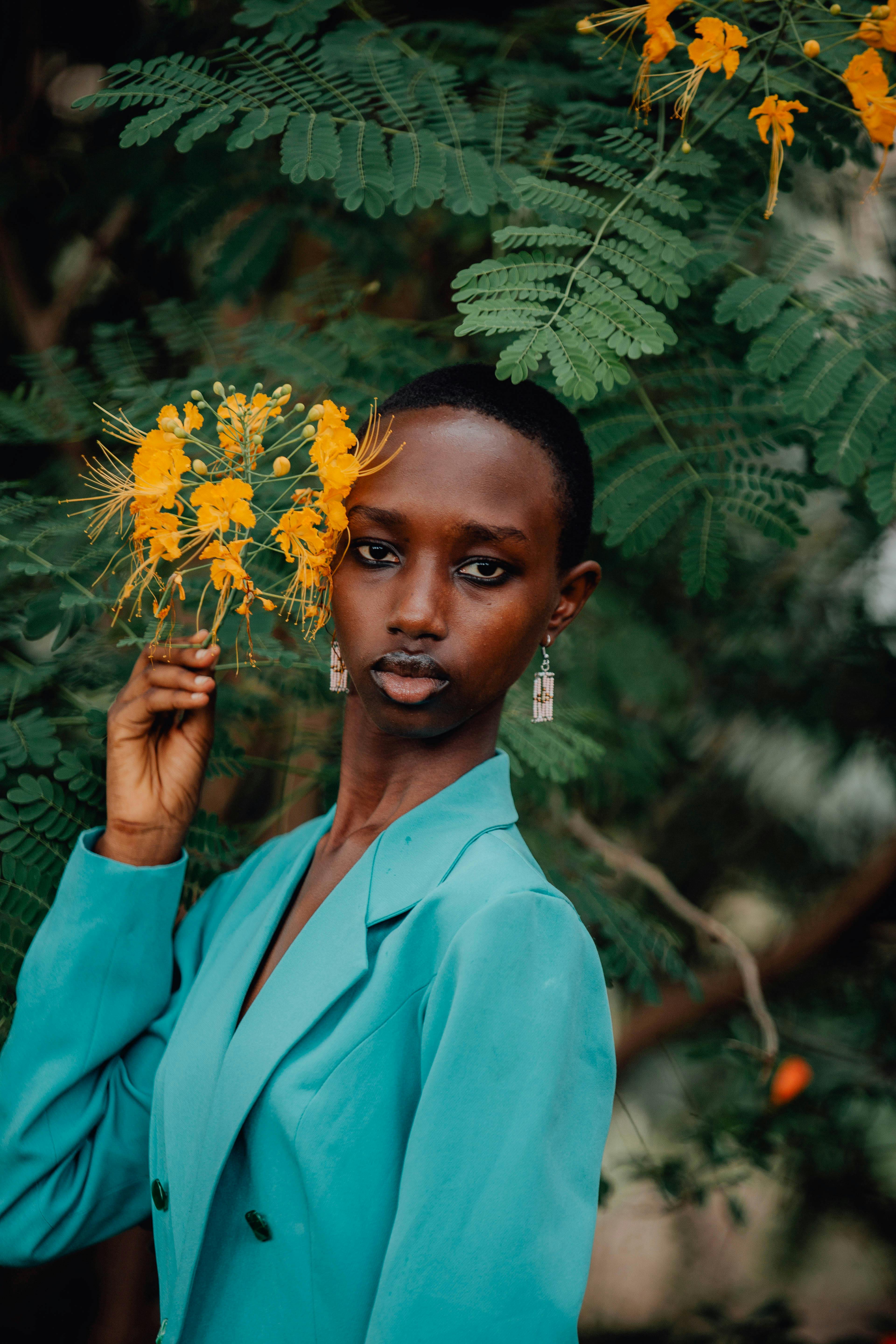 vibrant portrait of woman with yellow blossoms