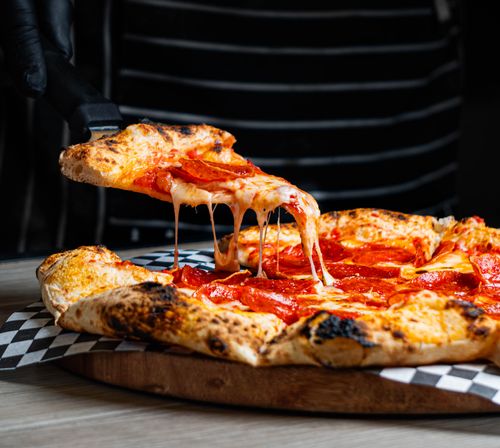 Sliced Pepperoni Pizza In Close up View Free Stock Photo sliced-pepperoni-pizza-in-close-up-view-free-stock-photo