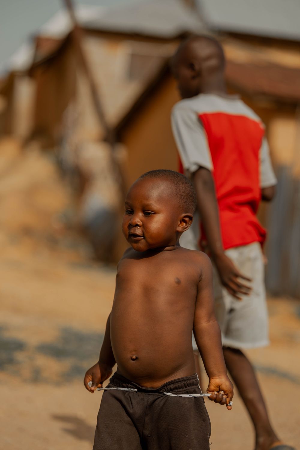 Authentic Snapshot of Children in Rustic Setting · Free Stock Photo