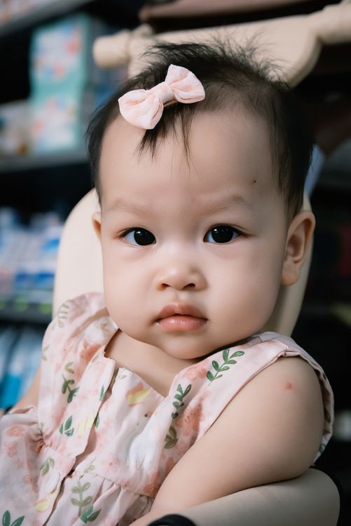 Adorable Baby Girl with Pink Bow Portrait · Free Stock Photo