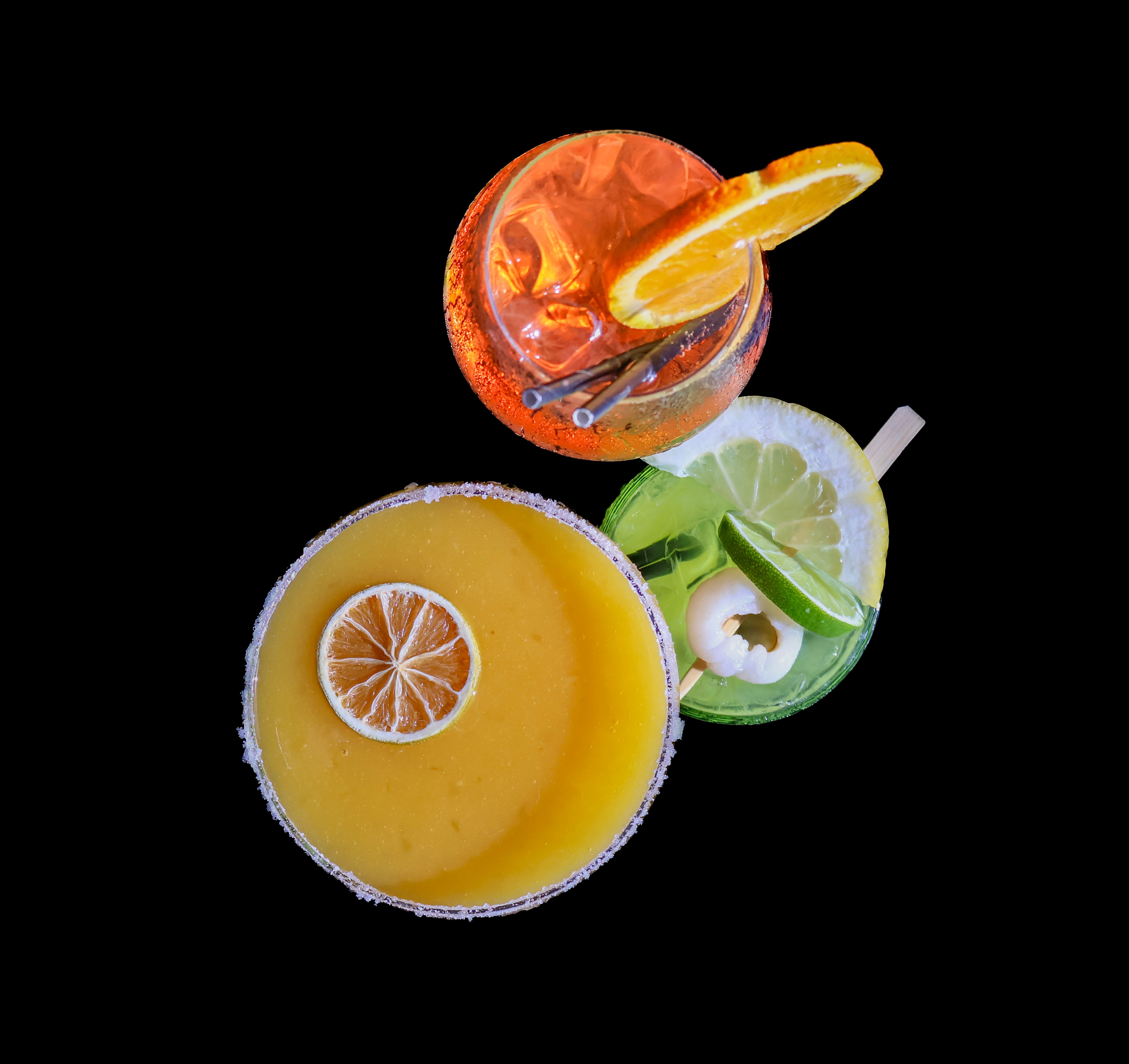 Vibrant Overhead View of Three Exotic Cocktails · Free Stock Photo
