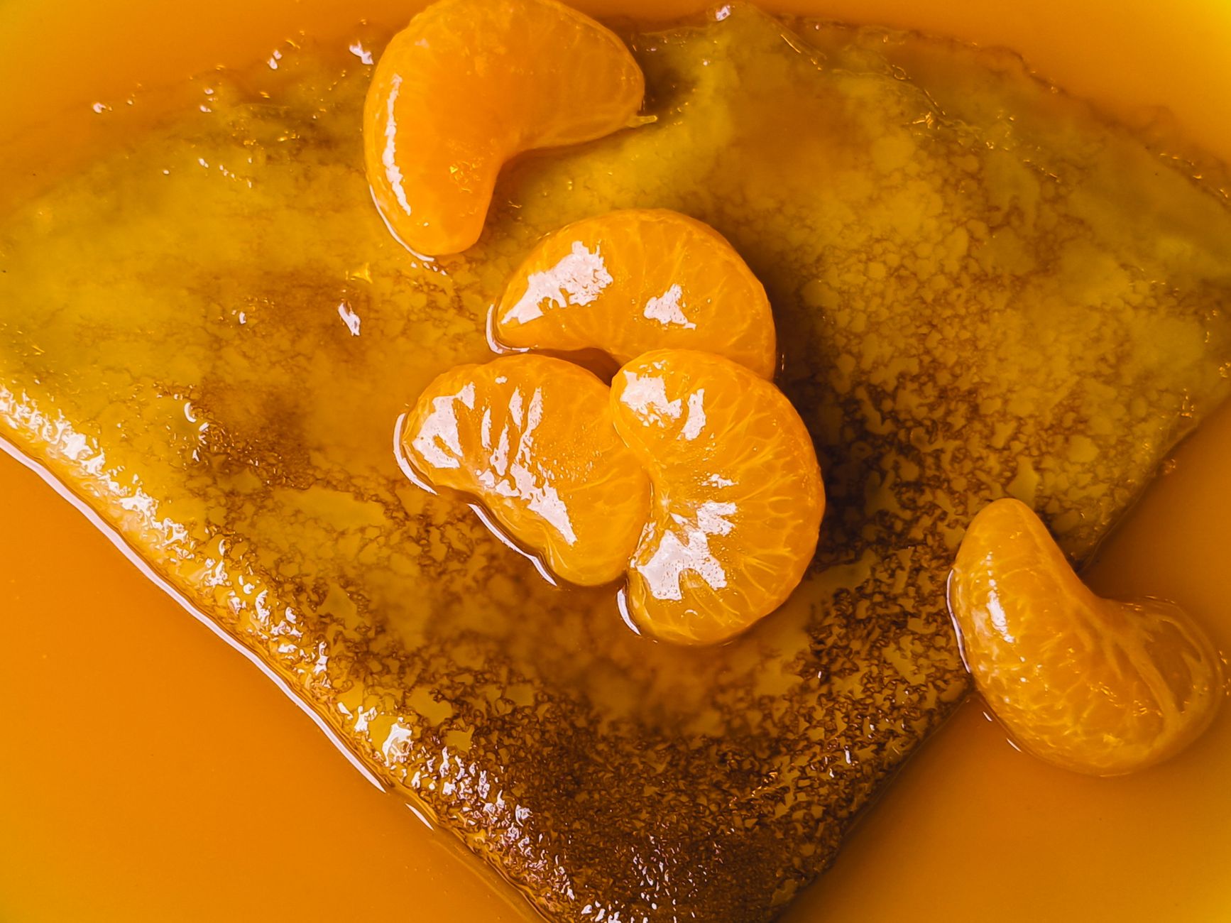 Bright orange zest and mustard glaze in bowl