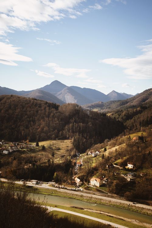Free A tranquil landscape showcasing picturesque villages in Slovenia surrounded by majestic mountains. Stock Photo