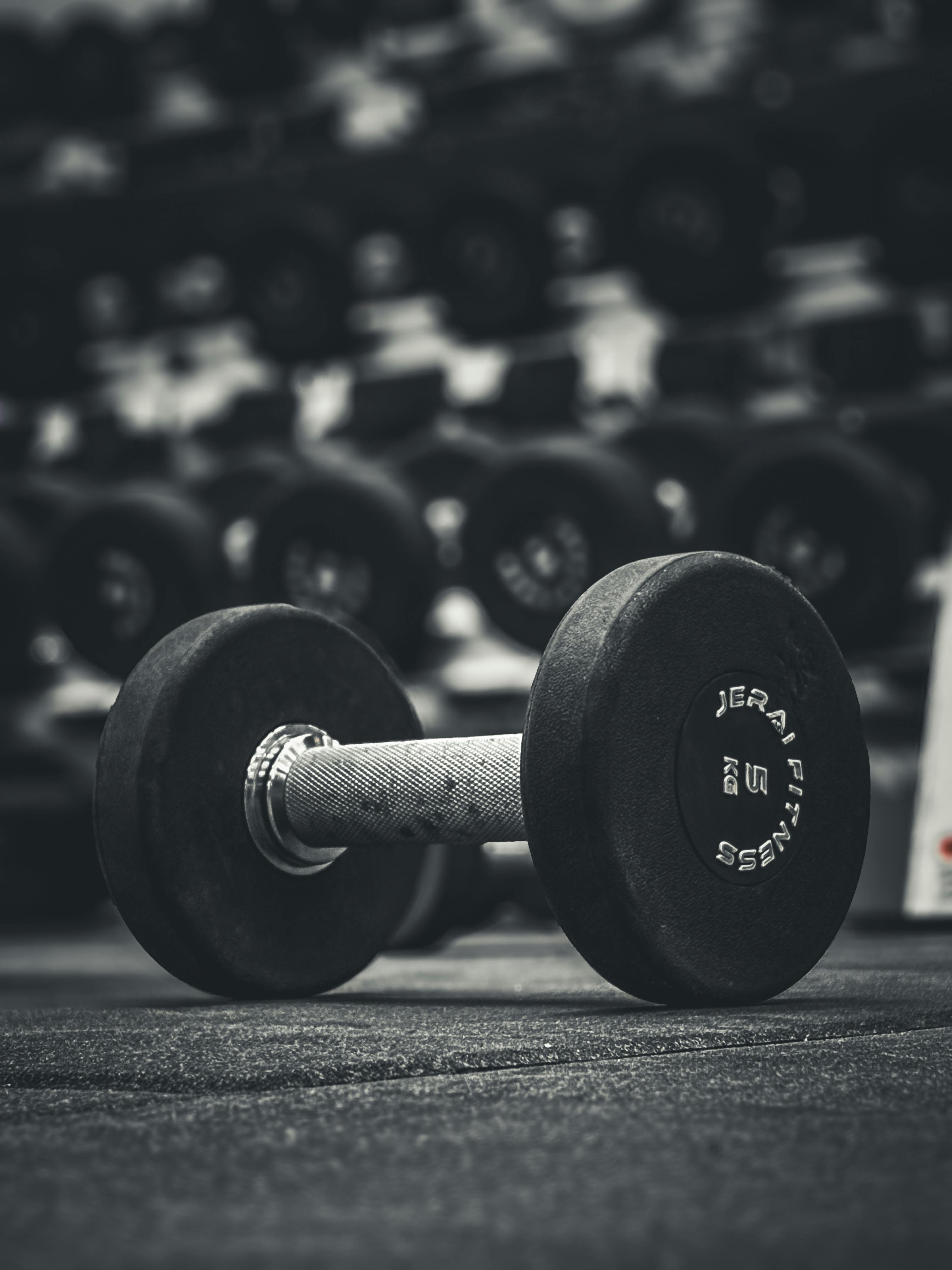 close up of dumbbell in gym setting