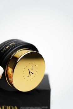 Minimalist black and gold skincare product with elegant packaging.