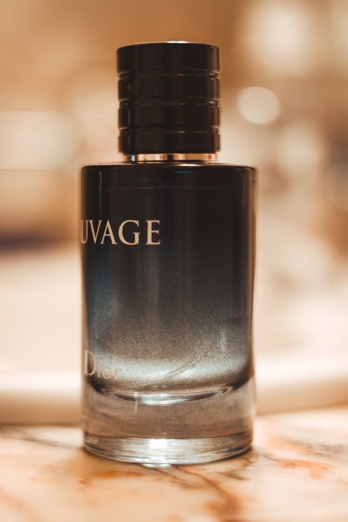 Free Close-up shot of a luxury perfume bottle with a blurred background, highlighting elegance and sophistication. Stock Photo