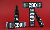 CBD oil products in packaging on display, highlighting sports and wellbeing benefits.
