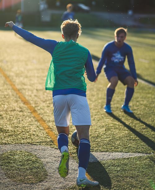 Free Vibrant image of young soccer players in active play on a sunny day outdoors. Stock Photo