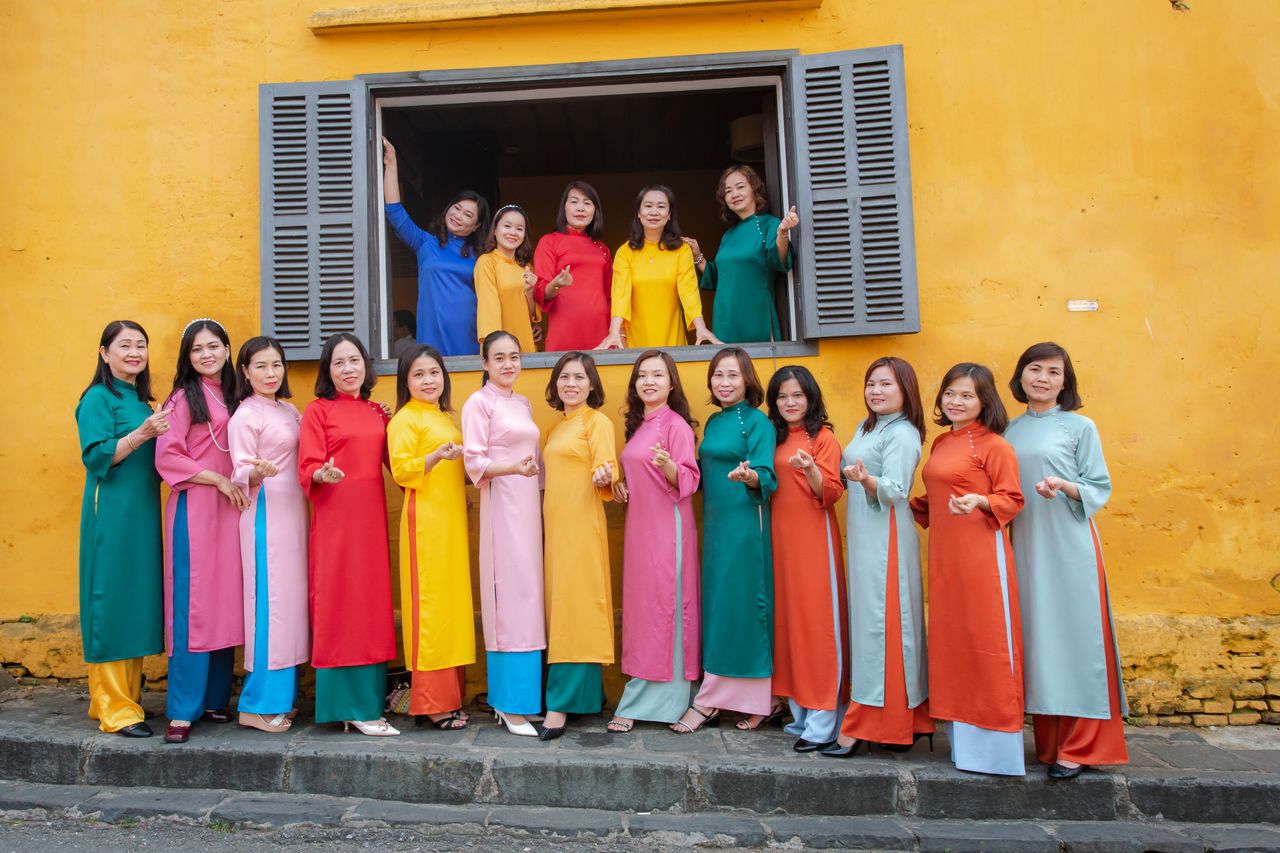 colorful group portrait of women in traditional ao dai in h i an vietn