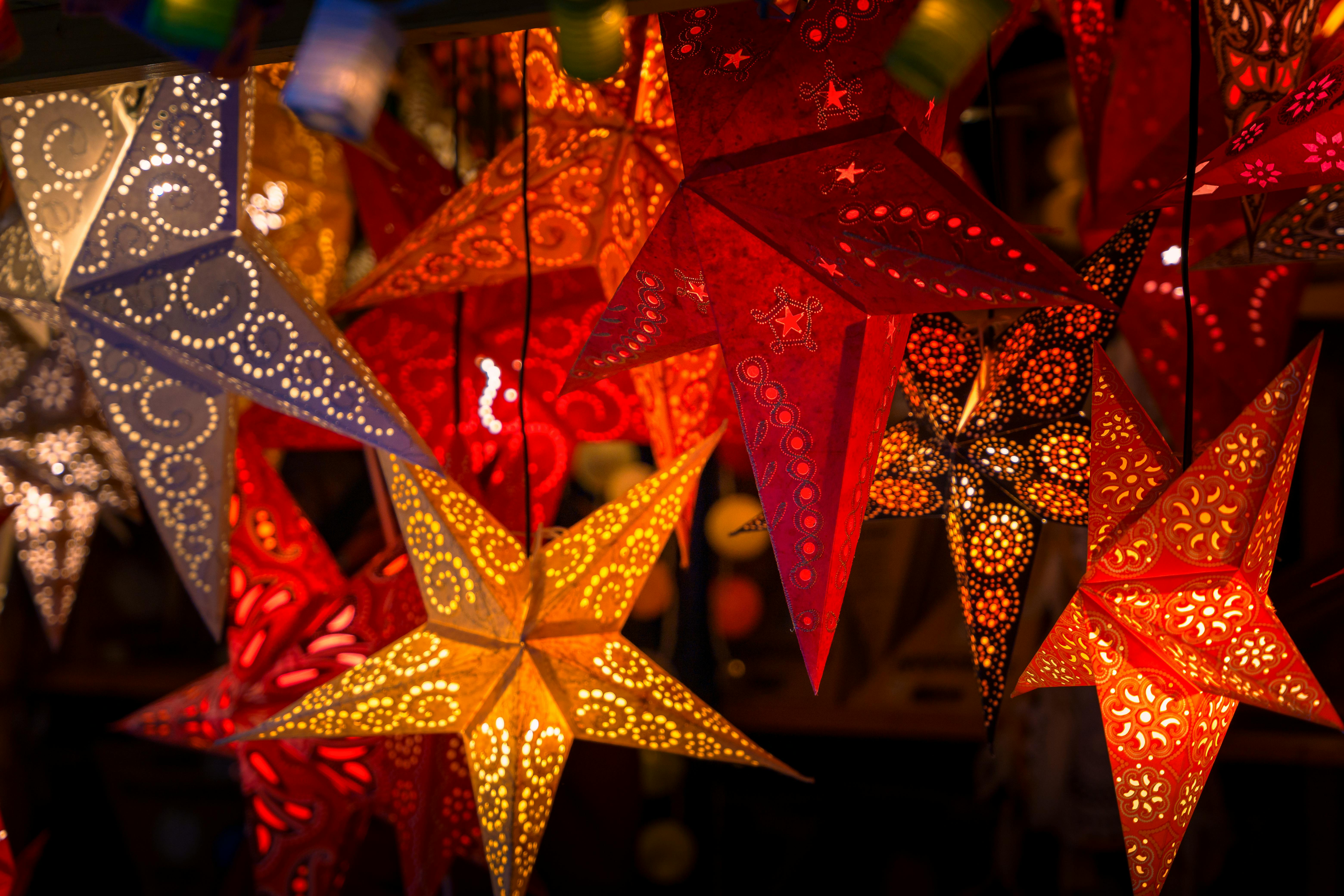 colorful star lanterns at german christmas market