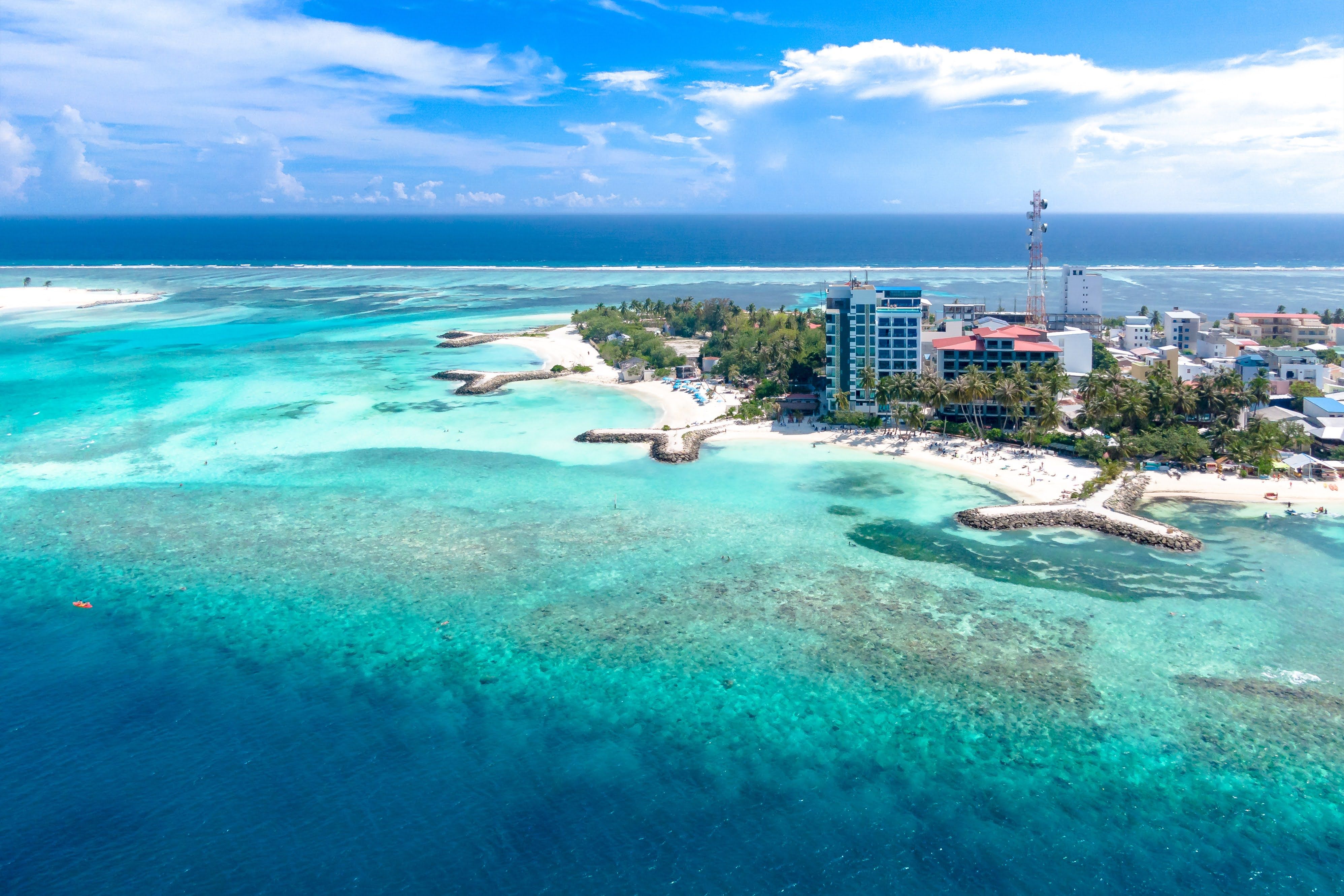 Vibrant aerial shot of a tropical island with turquoise waters and coastline.