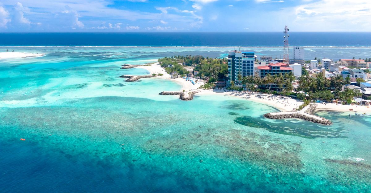 Vibrant aerial shot of a tropical island with turquoise waters and coastline.