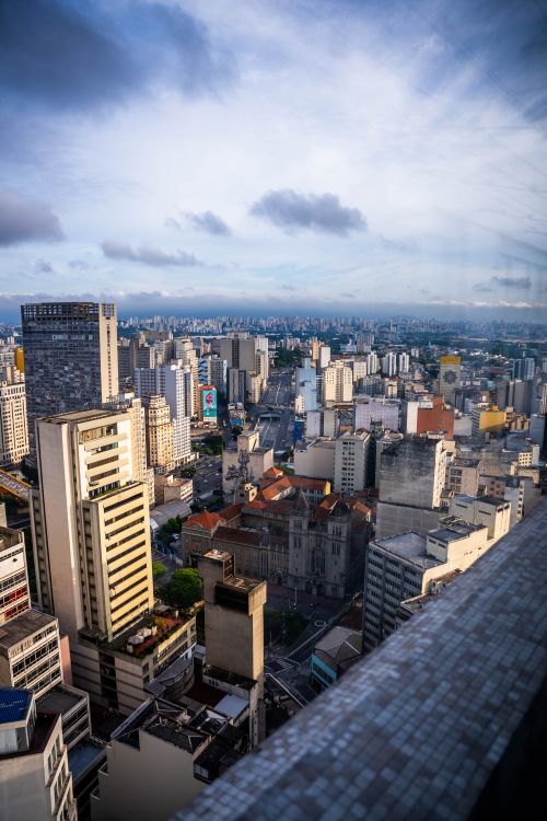 Free Stunning aerial view of São Paulo's urban skyline with skyscrapers and dramatic skies. Stock Photo